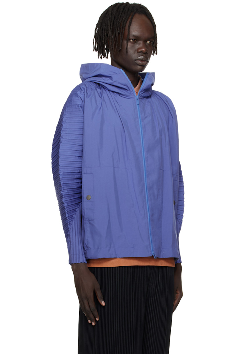 Lightweight ripstop jacket.

· Pleats at hood, dolman sleeves, and back
· Stand collar
· Zip closure
· Welt pockets 
· Concealed bungee-style drawstring at hem
· Unlined

Supplier color: Blue
