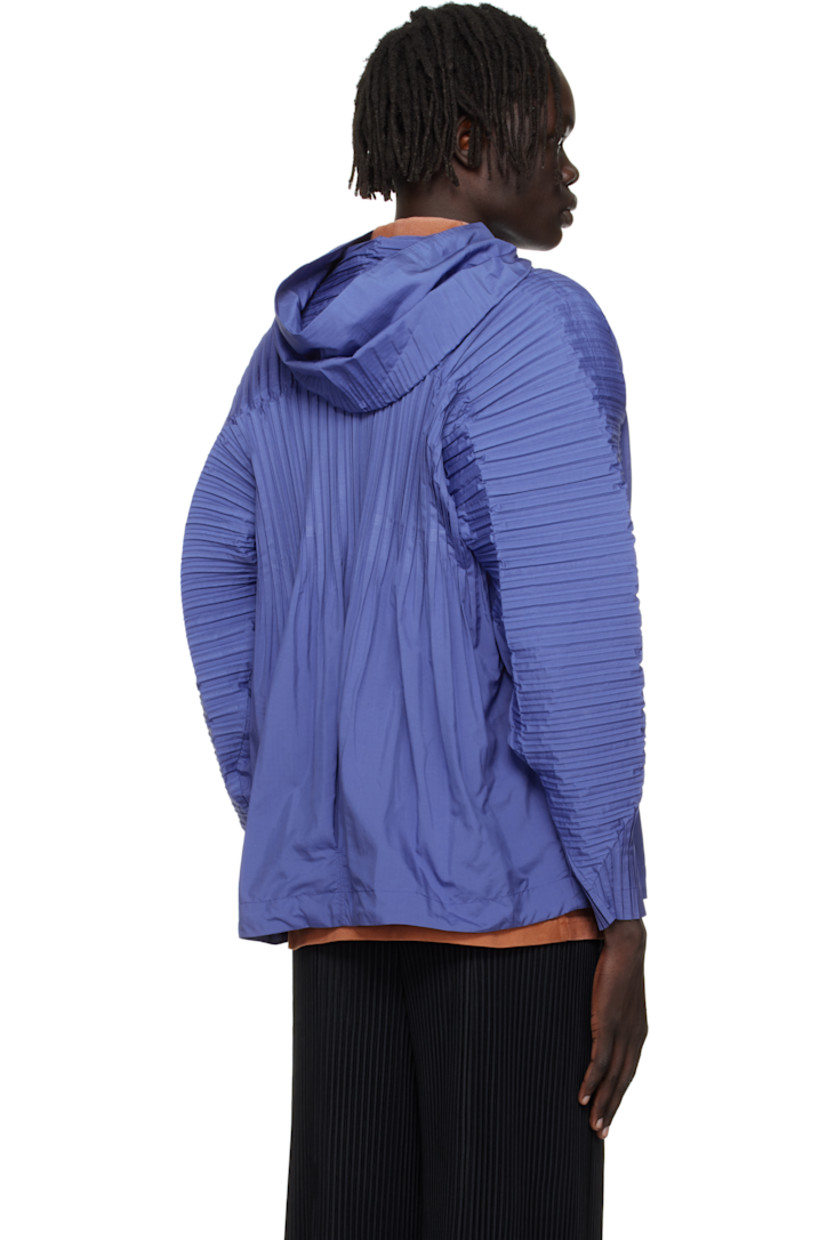 Lightweight ripstop jacket.

· Pleats at hood, dolman sleeves, and back
· Stand collar
· Zip closure
· Welt pockets 
· Concealed bungee-style drawstring at hem
· Unlined

Supplier color: Blue