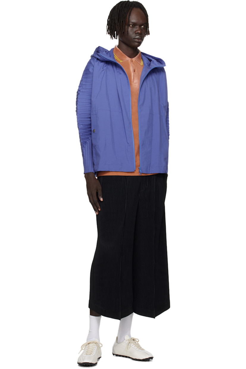 Lightweight ripstop jacket.

· Pleats at hood, dolman sleeves, and back
· Stand collar
· Zip closure
· Welt pockets 
· Concealed bungee-style drawstring at hem
· Unlined

Supplier color: Blue