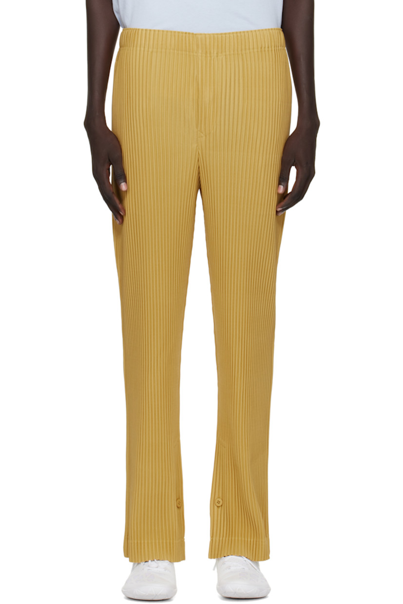 Garment-pleated tricot trousers.

· Quick-drying
· Straight-leg
· Concealed drawstring at elasticized waistband
· Two-pocket styling
· Button fly
· Button vent at inner cuffs

Supplier color: Wall yellow
