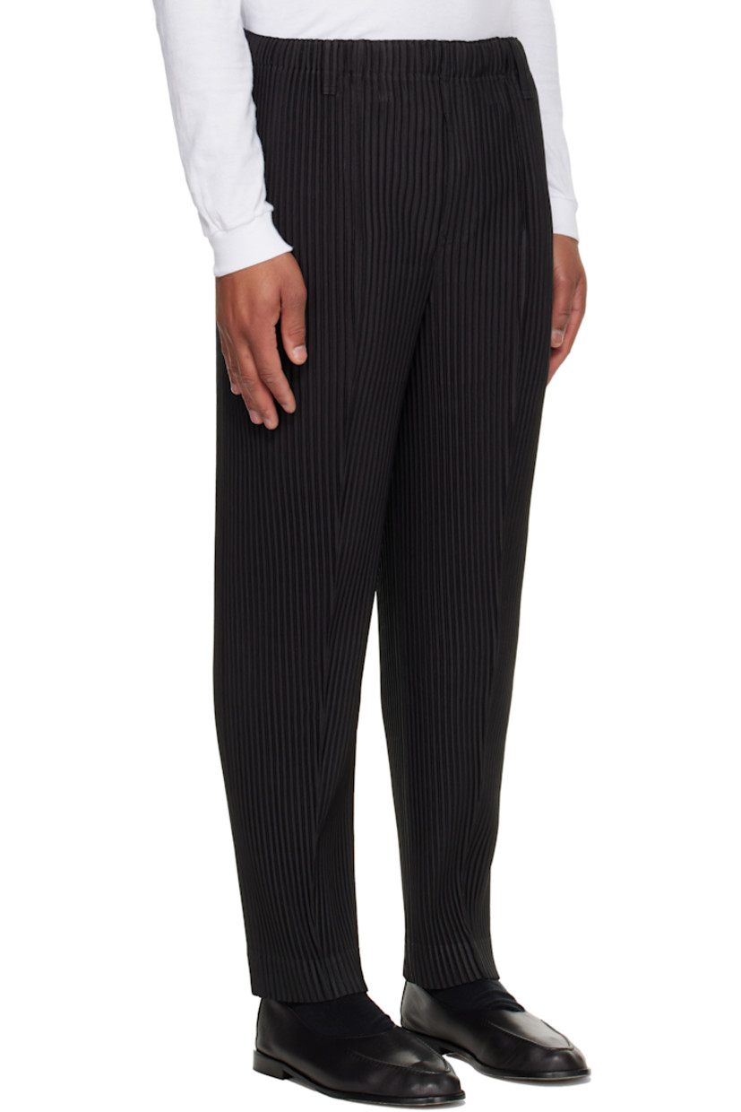 Garment-pleated tricot trousers.

· Belt loops at elasticized waistband
· Two-pocket styling 
· Button fly

Supplier color: Coke gray