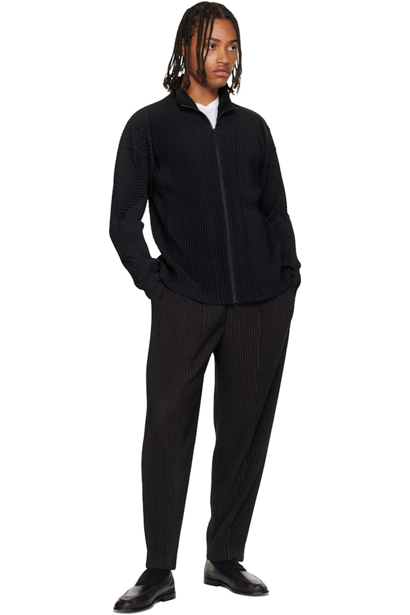 Garment-pleated tricot trousers.

· Belt loops at elasticized waistband
· Two-pocket styling 
· Button fly

Supplier color: Coke gray