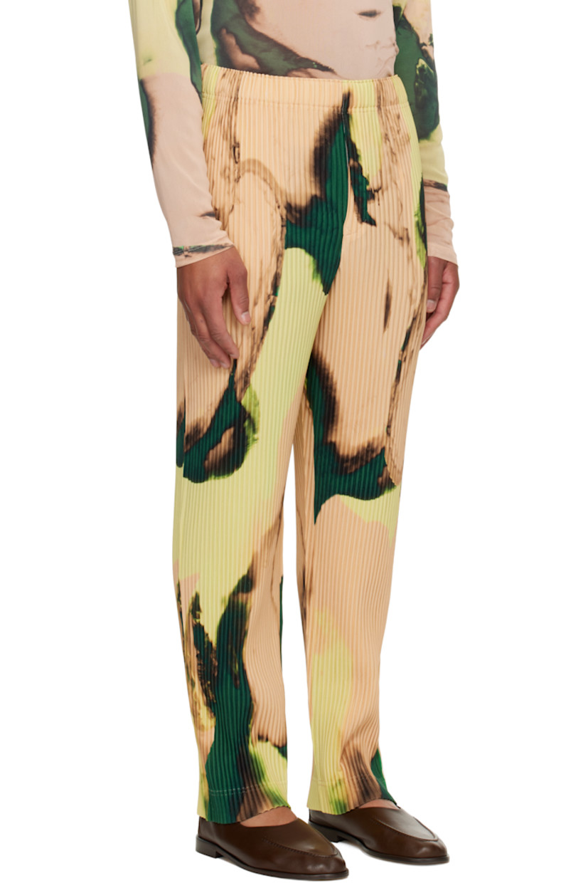 Garment-pleated tricot trousers.

· Graphic pattern printed throughout
· Straight-leg
· Elasticized waistband
· Two-pocket styling 
· Button fly

Supplier color: Orange beige