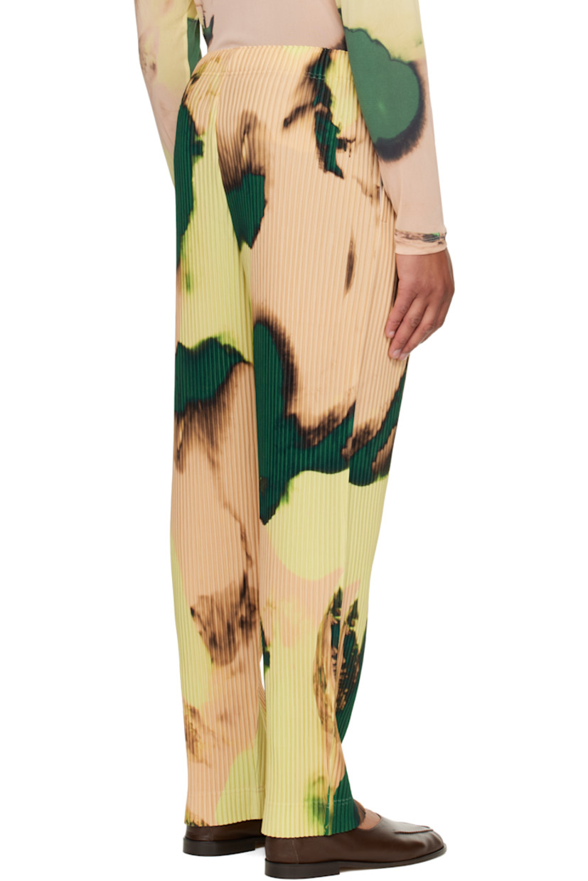 Garment-pleated tricot trousers.

· Graphic pattern printed throughout
· Straight-leg
· Elasticized waistband
· Two-pocket styling 
· Button fly

Supplier color: Orange beige