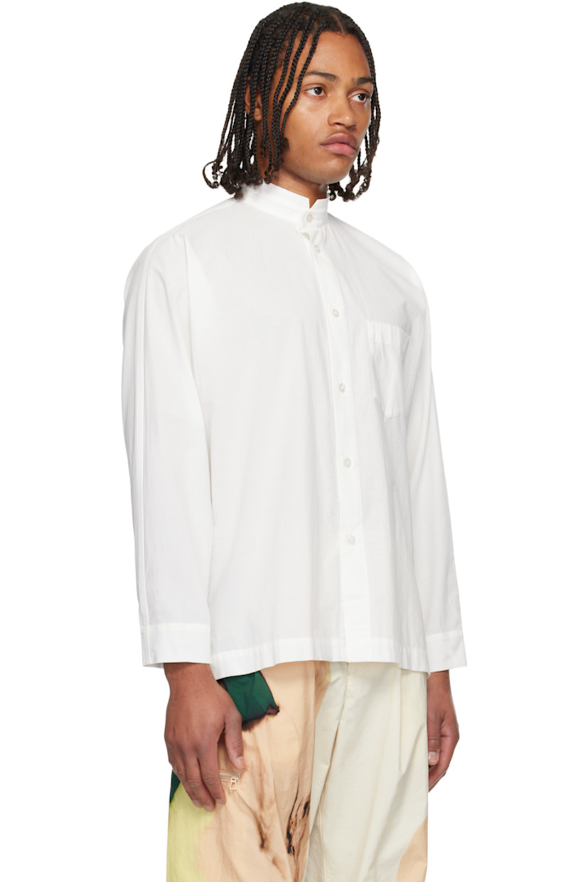Semi-sheer crinkled organic cotton poplin shirt. 

· Band collar 
· Button closure 
· Patch pocket at chest
· Vented side seams
· Buttoned barrel cuffs
· Box pleat at back yoke 

Supplier color: White