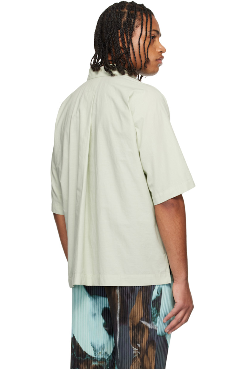Semi-sheer crinkled organic cotton poplin shirt. 

· Spread collar 
· Button closure 
· Patch pocket at chest
· Vented side seams
· Box pleat at back yoke 

Supplier color: White green