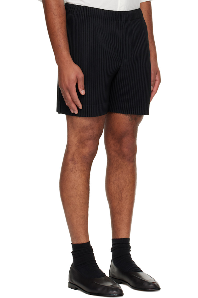 Garment-pleated tricot shorts.

· Elasticized waistband
· Two-pocket styling 
· Button fly

Supplier color: Black