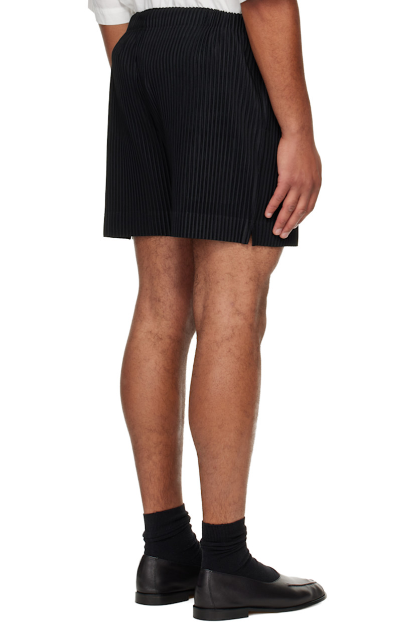 Garment-pleated tricot shorts.

· Elasticized waistband
· Two-pocket styling 
· Button fly

Supplier color: Black