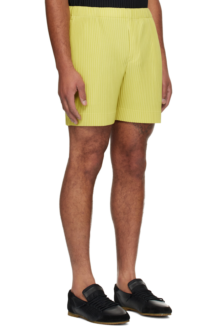 Garment-pleated polyester tricot shorts.

· Concealed drawstring at elasticized waistband
· Two-pocket styling
· Button fly 

Supplier color: Dusty yellow