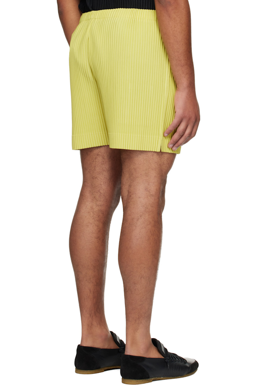 Garment-pleated polyester tricot shorts.

· Concealed drawstring at elasticized waistband
· Two-pocket styling
· Button fly 

Supplier color: Dusty yellow