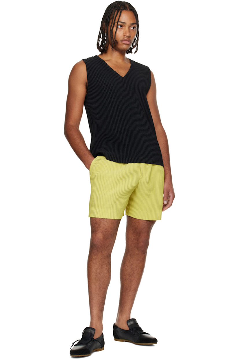 Garment-pleated polyester tricot shorts.

· Concealed drawstring at elasticized waistband
· Two-pocket styling
· Button fly 

Supplier color: Dusty yellow
