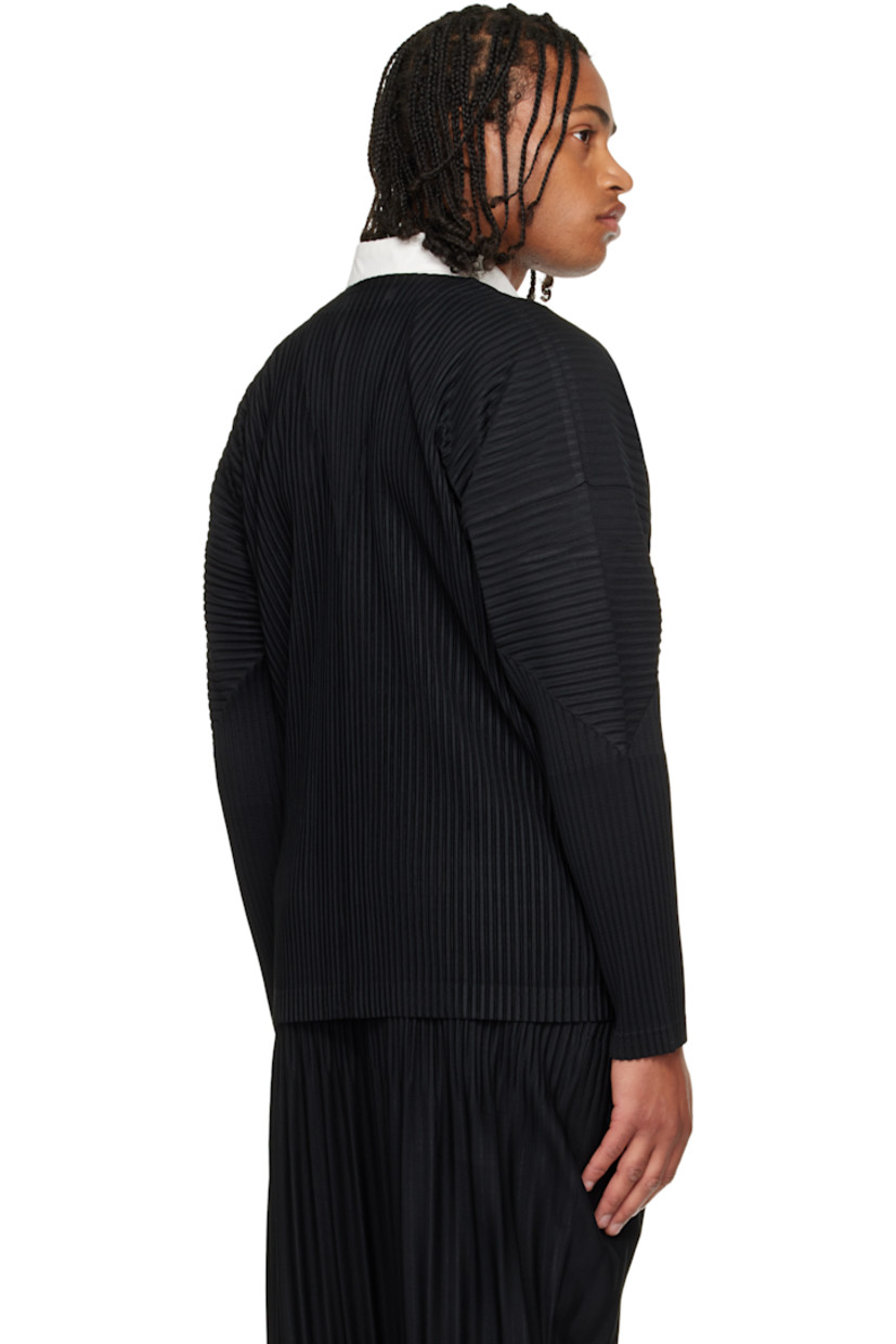 Garment-pleated tricot cardigan.

· Y-neck
· Press-stud closure

Supplier color: Black