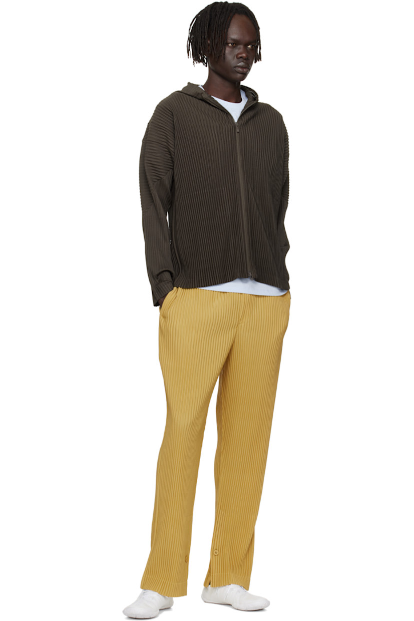 Lightweight garment-pleated tricot hoodie. 

· Quick-drying
· Bungee-style drawstring at hood
· Two-way zip closure
· Seam pockets
· Dolman sleeves

Supplier color: Mud brown