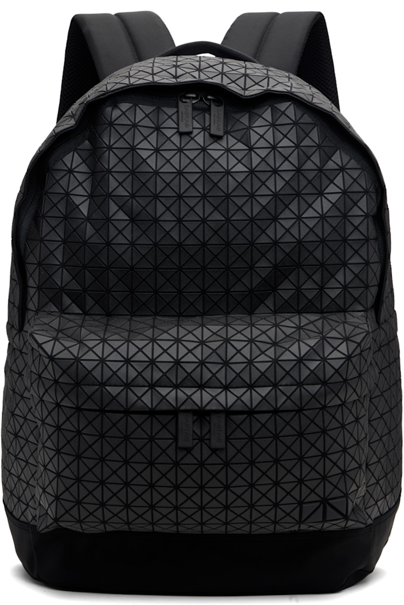 Cotton canvas backpack.

· Signature triangular vinyl appliqués throughout
· Rolled carry handle
· Adjustable padded shoulder straps
· Zip compartment with logo appliqué at face
· Padded mesh panel and leather trim at back face
· Two-way zip closure
· Zip pocket and patch pockets at interior
· Canvas lining
· H17.25" x W13.23" x D5.75"

Supplier color: Matte black