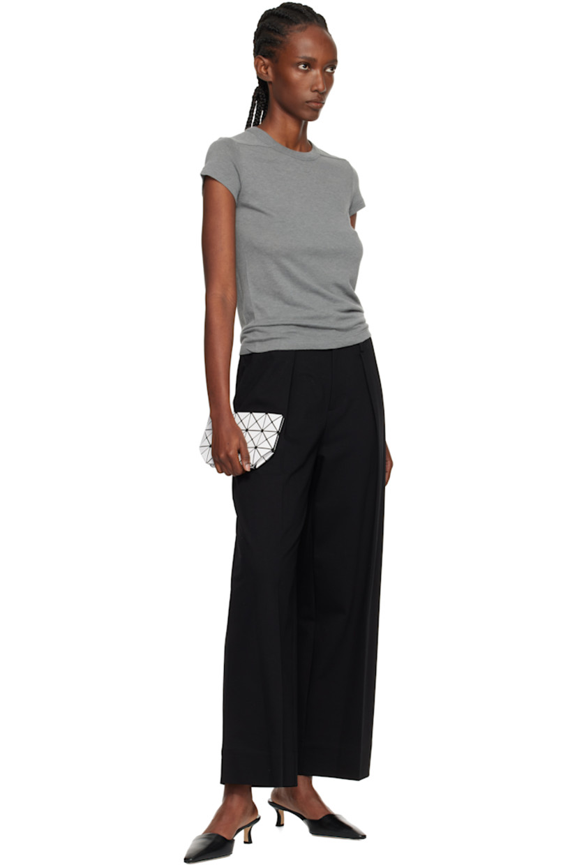 Mesh pouch.

· Signature triangular vinyl appliqués in white throughout
· Zip closure
· Logo-woven canvas lining 
· H4.5" x W8" x D3"

Supplier color: White