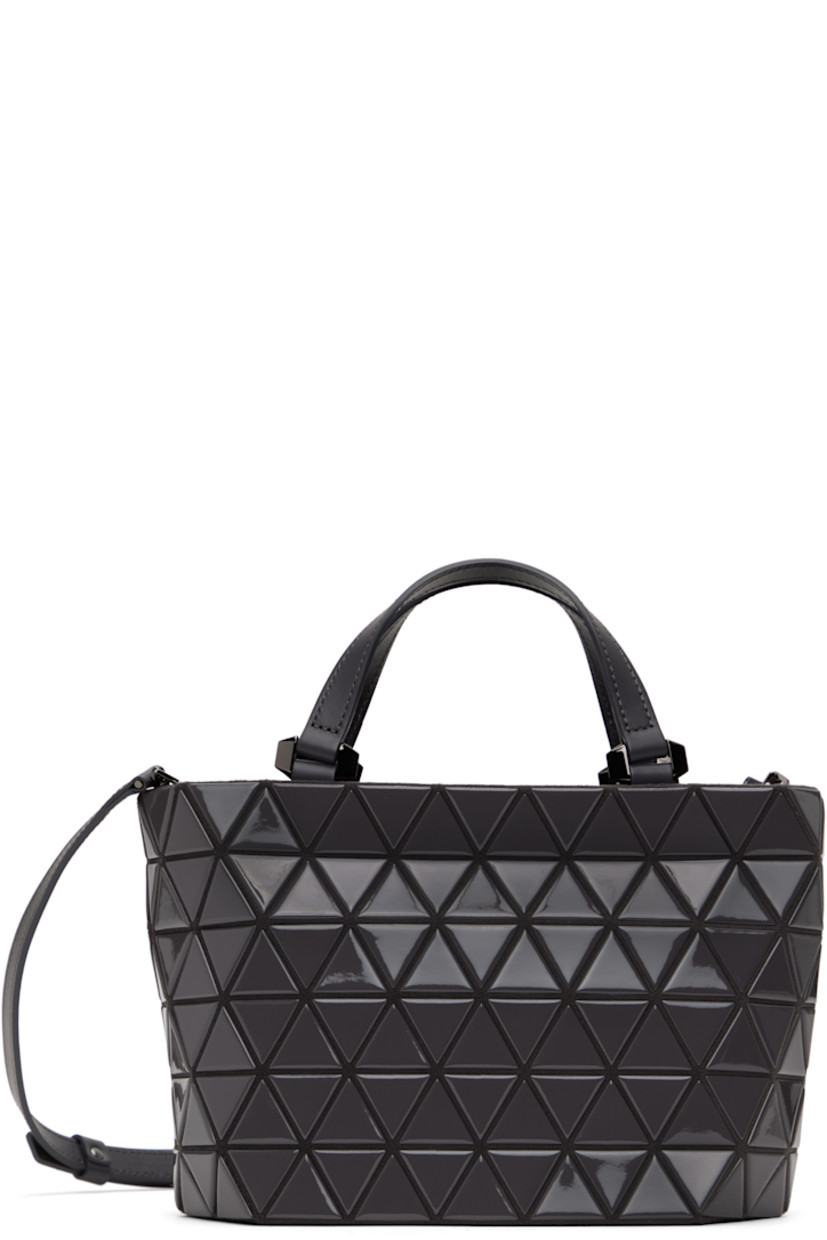 Felted top handle bag in gray.

· Triangular glossy polymer appliqués throughout
· Leather carry handles
· Adjustable and detachable leather crossbody strap
· Zip closure
· Zip pocket at interior
· Patterned textile lining
· Gunmetal-tone hardware
· H6.5" x W10" x D4.25"

Supplier color: Charcoal