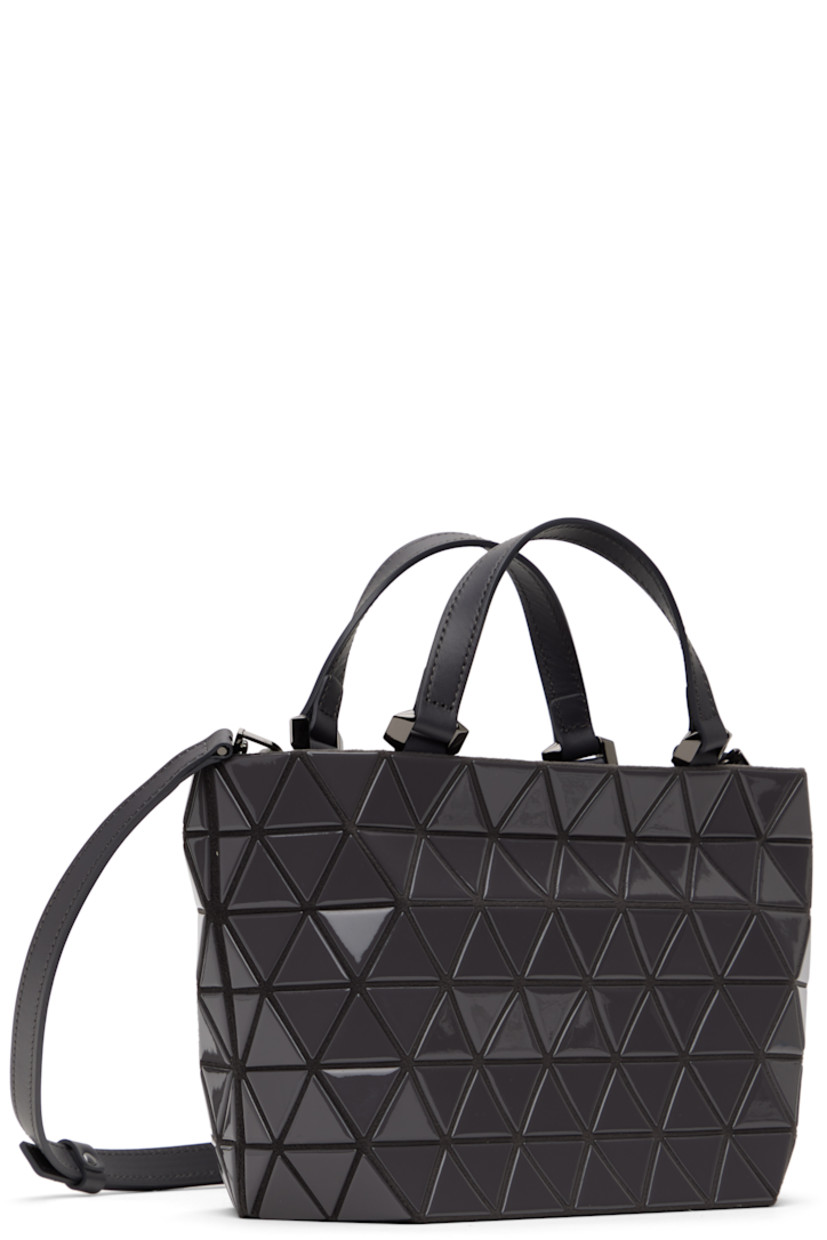 Felted top handle bag in gray.

· Triangular glossy polymer appliqués throughout
· Leather carry handles
· Adjustable and detachable leather crossbody strap
· Zip closure
· Zip pocket at interior
· Patterned textile lining
· Gunmetal-tone hardware
· H6.5" x W10" x D4.25"

Supplier color: Charcoal