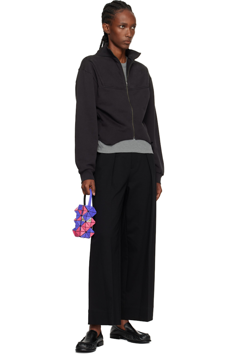 Sculptural mesh top handle bag.

· Signature triangular vinyl appliqués in blue and red throughout
· Fixed carry handle
· Lenticular graphic appliqués at face and back face
· Logo-woven canvas lining
· H6" x W3.5" x D2"

Supplier color: Blue /Red