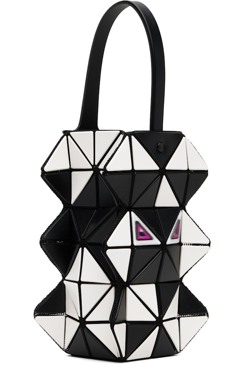 Sculptural mesh top handle bag.

· Signature triangular vinyl appliqués in black and off-white throughout
· Fixed carry handle
· Lenticular graphic appliqués at face and back face
· Logo-woven canvas lining
· H6" x W3.5" x D2"

Supplier color: Black/Off white