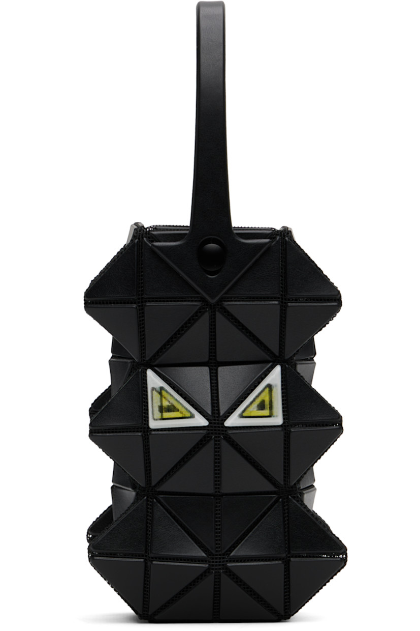 Sculptural mesh top handle bag.

· Signature triangular vinyl appliqués throughout
· Fixed carry handle
· Lenticular graphic appliqués at face and back face
· Logo-woven canvas lining
· H6" x W3.5" x D2"

Supplier color: Black