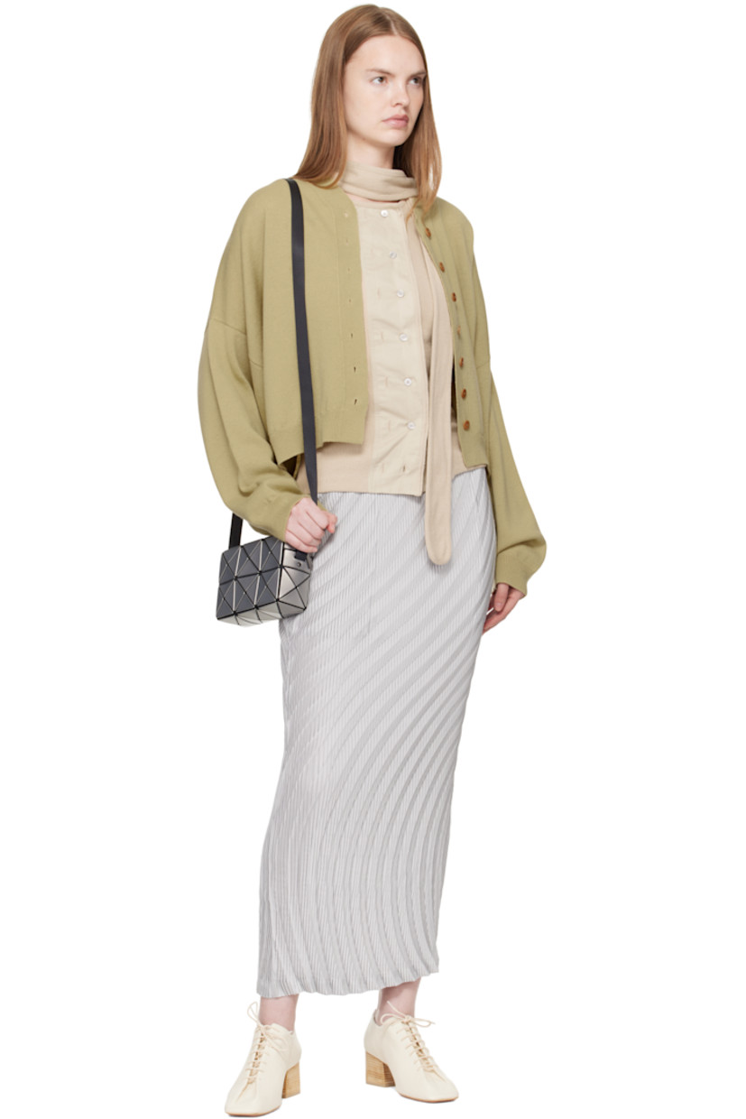 Mesh shoulder bag.

· Signature triangular faux-leather appliqués in silver tone
· Adjustable and semi-detachable webbing shoulder strap
· Zip closure
· Patch pocket at interior
· Logo-woven lining
· H4.5" x W7" x D2.25"

Supplier color: Silver
