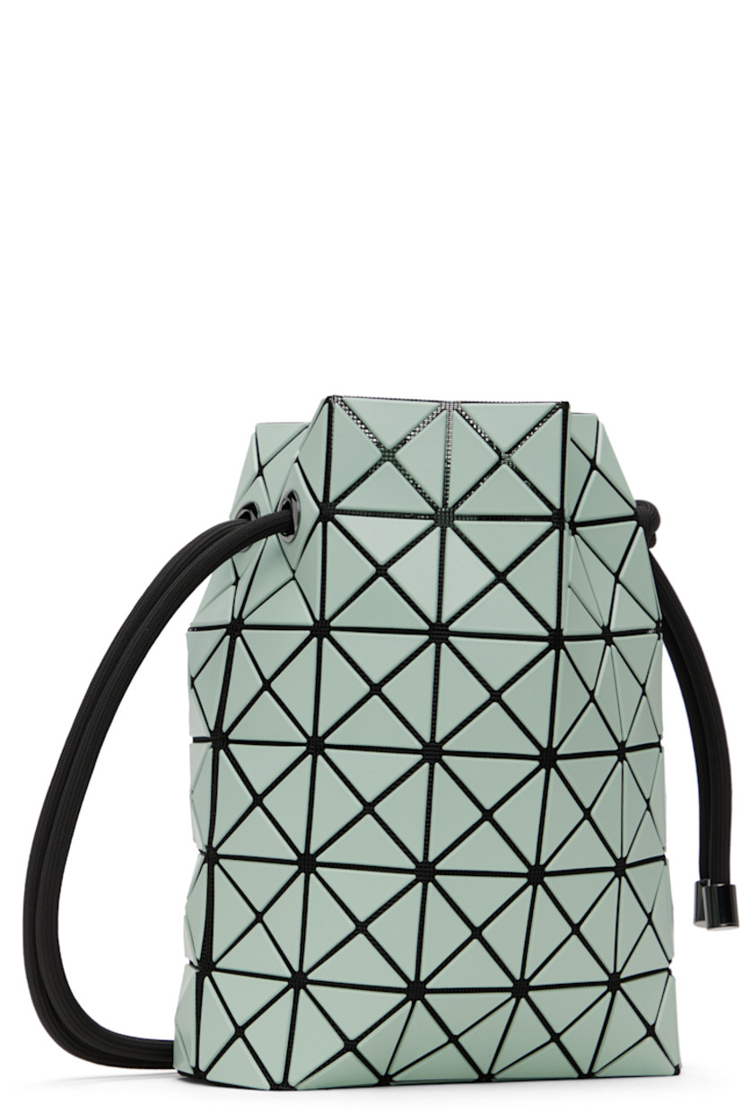 Mesh shoulder bag in black. 

· Triangular faux-leather appliqués in green throughout
· Adjustable drawstring shoulder strap
· Open throat
· Zip pocket at interior
· Patterned textile lining
· H9" x W8" x D3.5"

Supplier color: Mint green