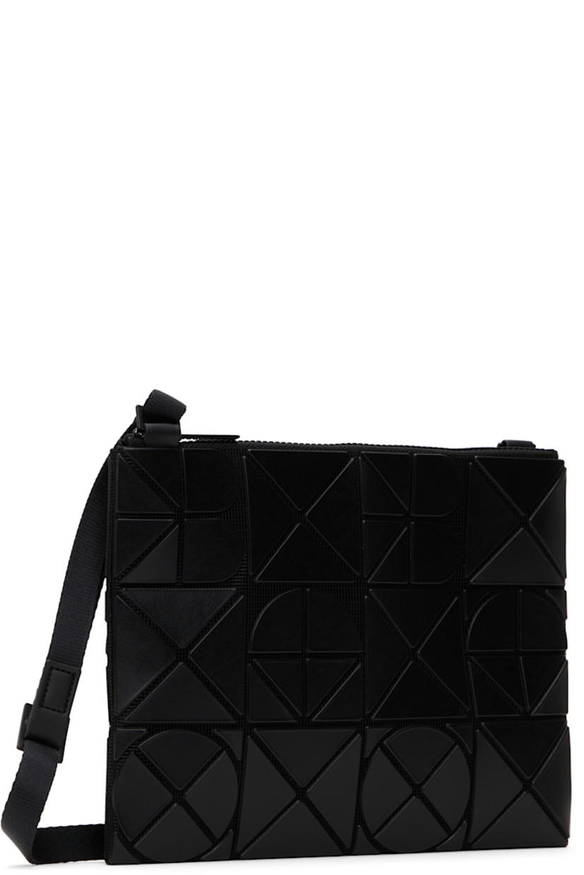 Mesh shoulder bag in black. 

· Triangular faux-leather logo appliqués throughout
· Adjustable crossbody strap
· Zip closure
· Zip pocket at interior
· Patterned textile lining
· H9" x W7"

Supplier color: Matte black