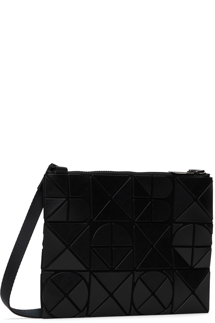 Mesh shoulder bag in black. 

· Triangular faux-leather logo appliqués throughout
· Adjustable crossbody strap
· Zip closure
· Zip pocket at interior
· Patterned textile lining
· H9" x W7"

Supplier color: Matte black