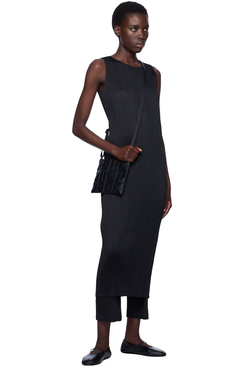 Mesh shoulder bag in black. 

· Triangular faux-leather logo appliqués throughout
· Adjustable crossbody strap
· Zip closure
· Zip pocket at interior
· Patterned textile lining
· H9" x W7"

Supplier color: Matte black