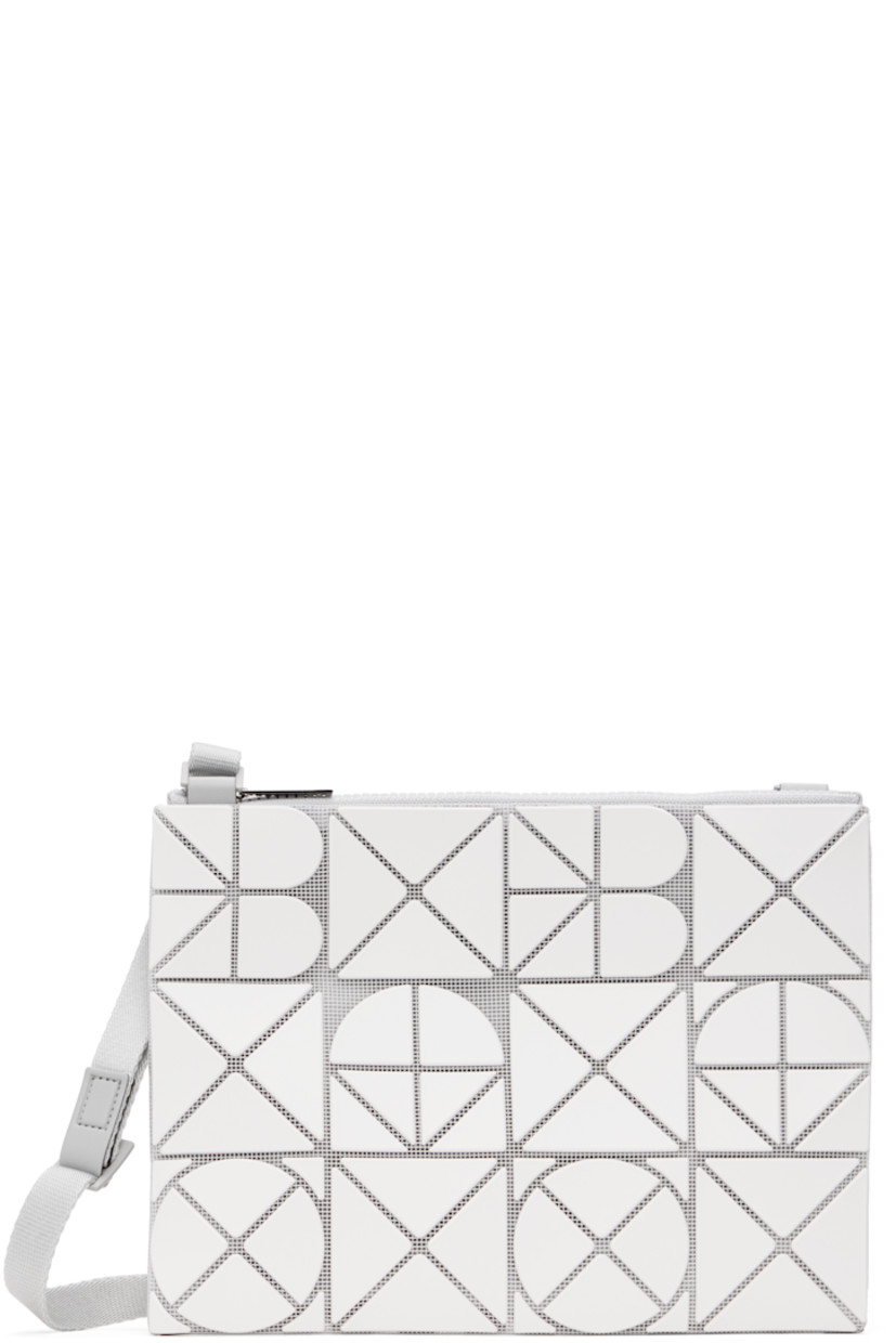 Mesh shoulder bag in white. 

· Triangular faux-leather logo appliqués throughout
· Adjustable crossbody strap
· Zip closure
· Zip pocket at interior
· Patterned textile lining
· H9" x W7"

Supplier color: Matte white