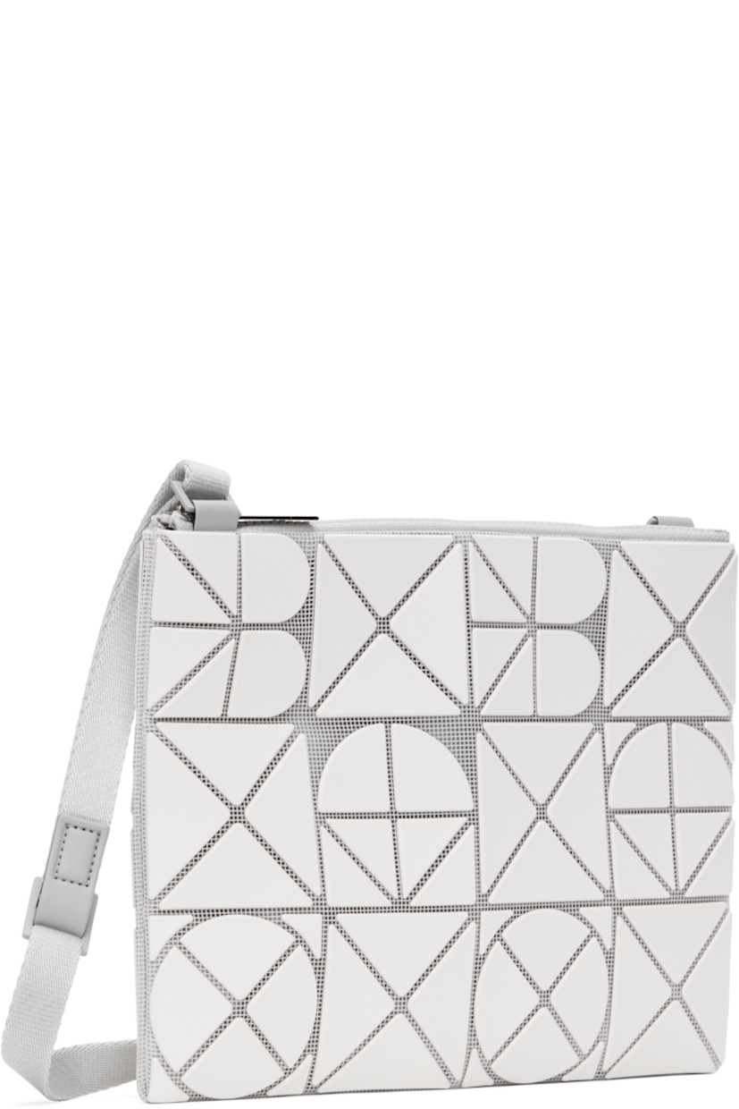 Mesh shoulder bag in white. 

· Triangular faux-leather logo appliqués throughout
· Adjustable crossbody strap
· Zip closure
· Zip pocket at interior
· Patterned textile lining
· H9" x W7"

Supplier color: Matte white