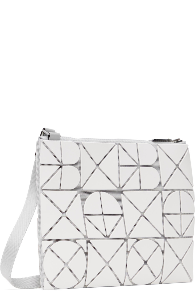 Mesh shoulder bag in white. 

· Triangular faux-leather logo appliqués throughout
· Adjustable crossbody strap
· Zip closure
· Zip pocket at interior
· Patterned textile lining
· H9" x W7"

Supplier color: Matte white