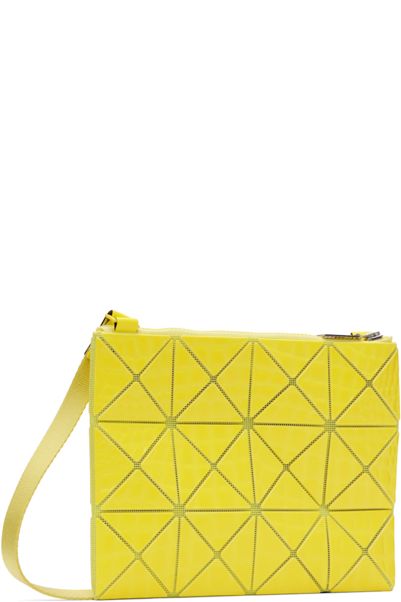 Mesh shoulder bag in yellow.

· Croc-embossed signature triangular vinyl appliqués throughout
· Adjustable crossbody strap
· Zip closure
· Logo-woven canvas lining
· Logo-engraved silver-tone hardware
· H7" x W9"

Supplier color: Yellow