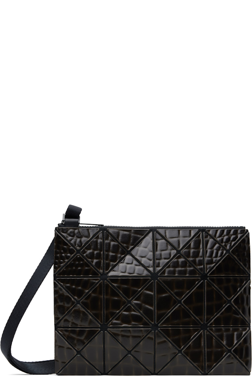 Mesh shoulder bag in black.

· Croc-embossed signature triangular vinyl appliqués throughout
· Adjustable crossbody strap
· Zip closure
· Logo-woven canvas lining
· Logo-engraved silver-tone hardware
· H7" x W9"

Supplier color: Black
