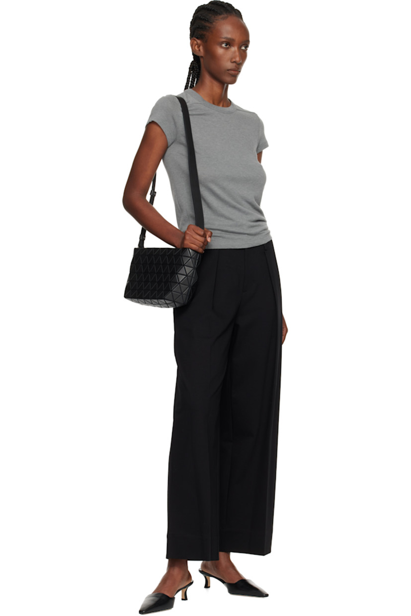 Melton shoulder bag.

· Signature triangular faux-leather appliqués throughout
· Adjustable leather crossbody strap
· Zip closure
· Patch pocket at interior
· Logo-woven canvas lining
· H6.25" x W10.5" x D4.5"

Supplier color: Matte black