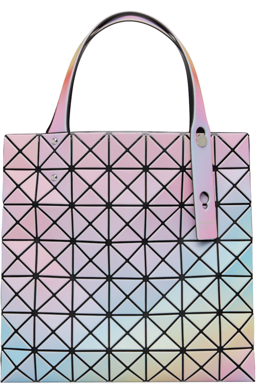 Mesh tote.

· Triangular iridescent vinyl appliqués throughout
· Adjustable shoulder straps
· Zip pocket at interior
· H11" x W11"

Supplier color: White base