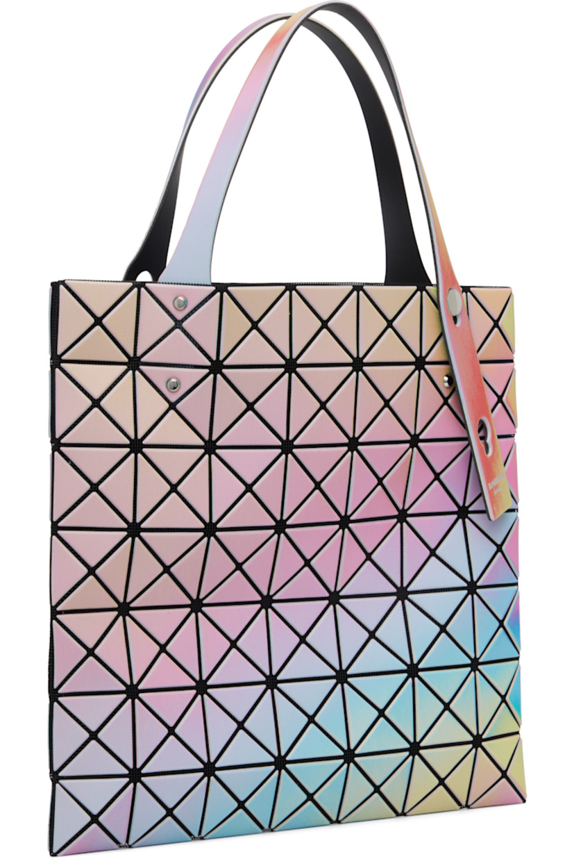 Mesh tote.

· Triangular iridescent vinyl appliqués throughout
· Adjustable shoulder straps
· Zip pocket at interior
· H11" x W11"

Supplier color: White base
