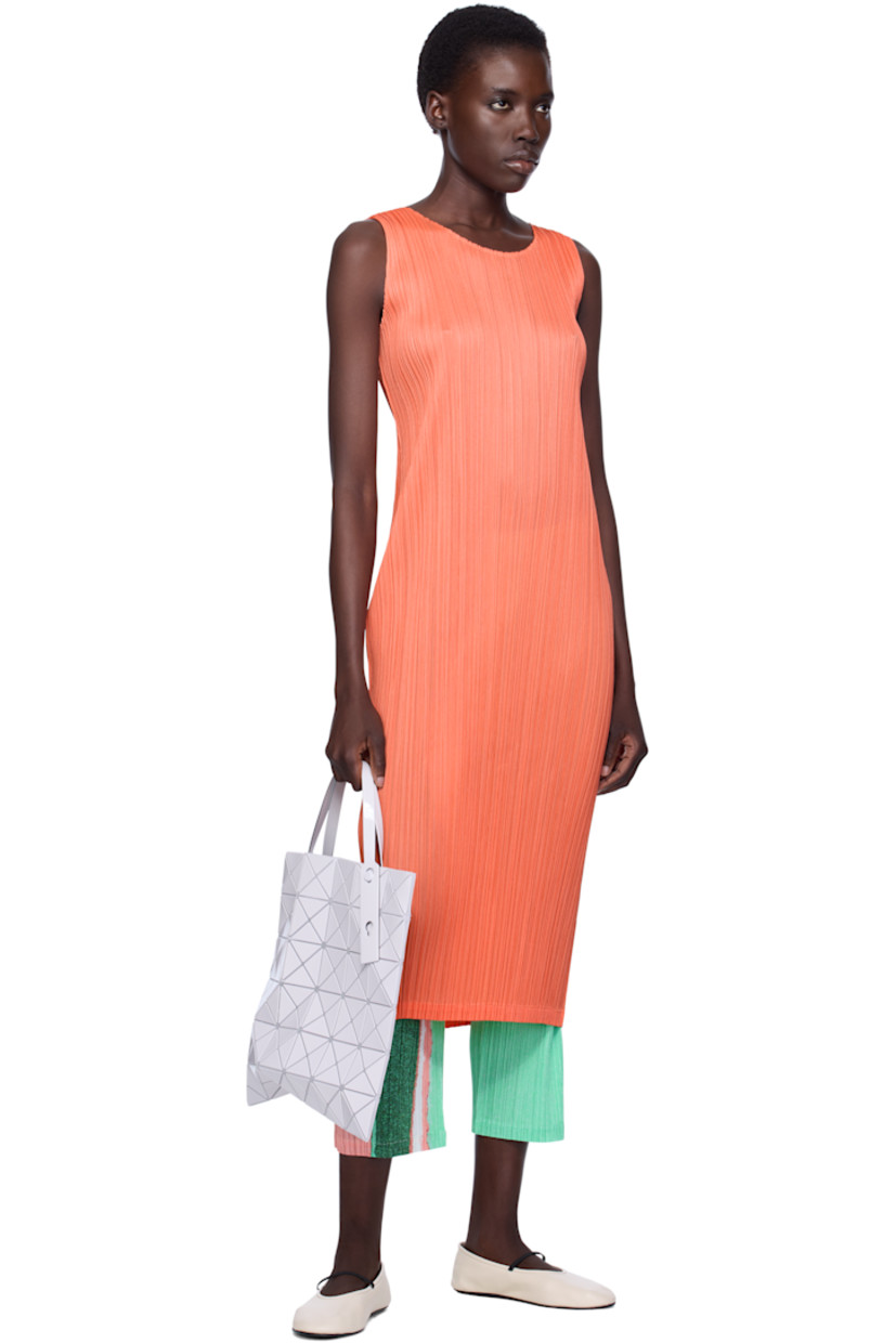 Sheer mesh tote in off-white. 

· Triangular glossy polymer appliqués throughout
· Twin adjustable faux-leather carry handles
· Zip pocket at interior
· Unlined
· H13.5" x W13.5"

Supplier color: Light gray