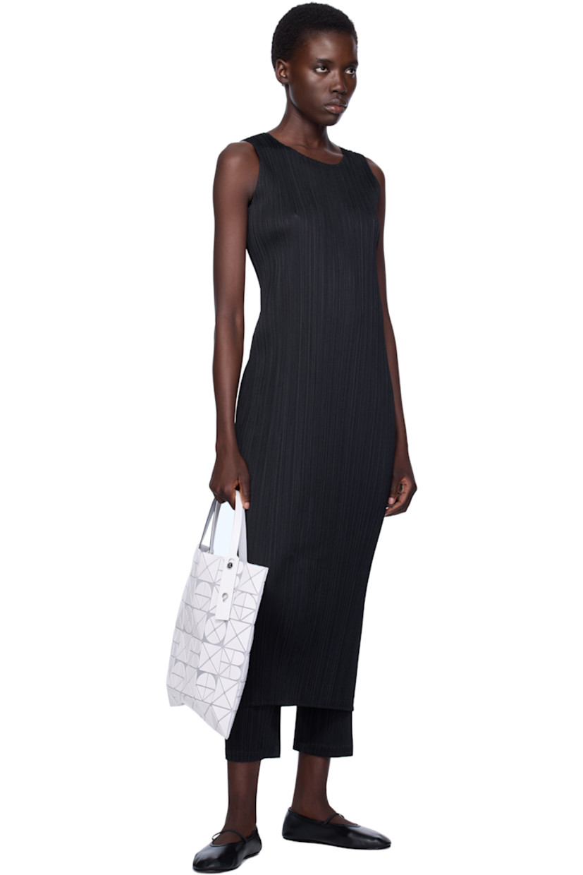 Sheer mesh tote in white. 

· Triangular faux-leather logo appliqués throughout
· Twin adjustable faux-leather carry handles
· Zip pocket at interior
· Unlined
· H13.5" x W13.5"

Supplier color: Matte white