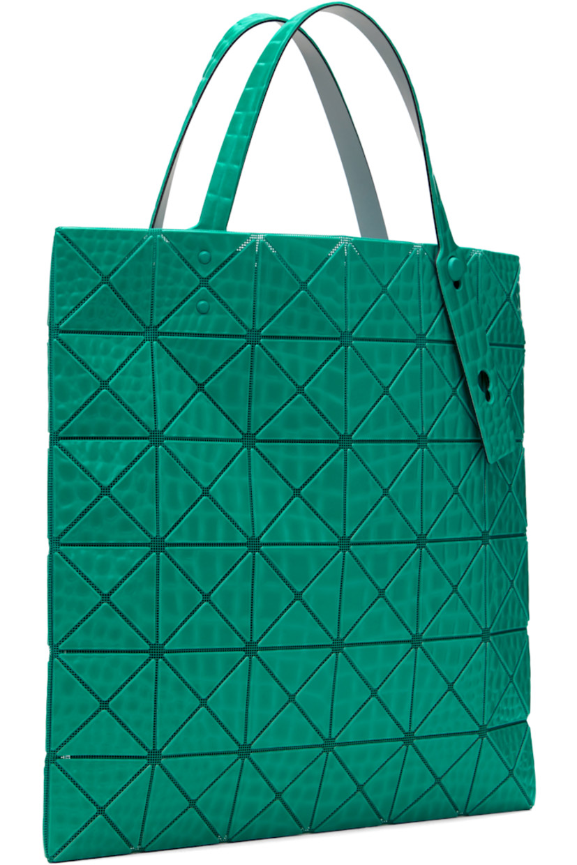Mesh tote in green.

· Croc-embossed signature triangular vinyl appliqués throughout
· Adjustable carry handles
· Open throat
· Zip pocket at interior
· H13.5" x W13.5"

Supplier color: Green
