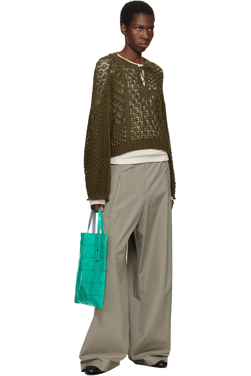Mesh tote in green.

· Croc-embossed signature triangular vinyl appliqués throughout
· Adjustable carry handles
· Open throat
· Zip pocket at interior
· H13.5" x W13.5"

Supplier color: Green