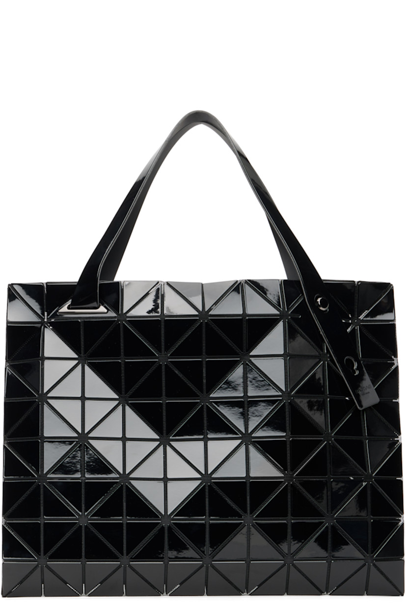 Mesh tote.

· Signature triangular vinyl appliqu�és throughout
· Adjustable shoulder straps
· Two-way zip closure
· Zip pocket at interior
· H12.5" x W12.5"

Supplier color: Black