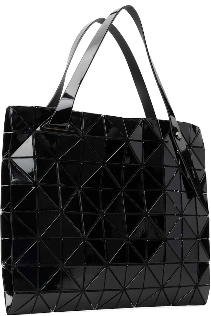 Mesh tote.

· Signature triangular vinyl appliqués throughout
· Adjustable shoulder straps
· Two-way zip closure
· Zip pocket at interior
· H12.5" x W12.5"

Supplier color: Black