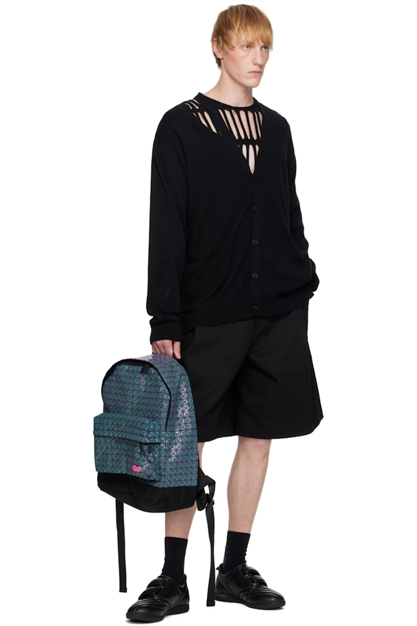 Cotton canvas backpack in black. Signature triangular vinyl appliqués in green and purple throughout.

· Fixed carry handle
· Adjustable padded shoulder straps
· Zip pocket and logo hardware at face
· Padded mesh panel at back face
· Two-way zip closure
· Zip pocket at interior
· Canvas lining
· H17.25" x W15" x D5"

Supplier color: Green