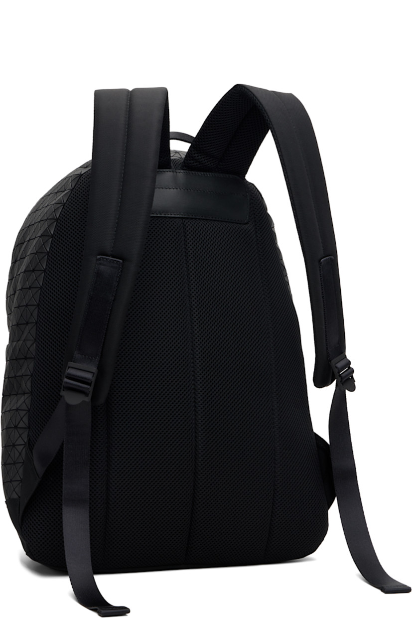 Cotton canvas backpack.

· Signature triangular vinyl appliqués throughout
· Rolled carry handle
· Adjustable padded shoulder straps
· Zip compartment with logo appliqué at face
· Padded mesh back face
· Two-way zip closure
· Zip pocket and patch pockets at interior
· Canvas lining
· H17.25" x W13.23" x D5.75"

Supplier color: Matte black