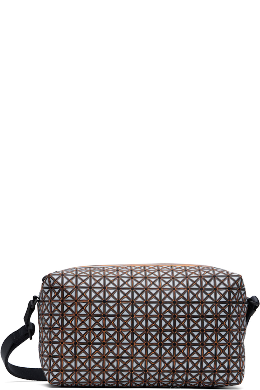 Cotton canvas messenger bag in black. Signature triangular vinyl appliqués in gray and orange throughout.

· Adjustable webbing crossbody strap
· Zip closure 
· Zip pocket at interior
· Canvas lining
· H5.5" x W10" x D4.25"

Supplier color: Gray