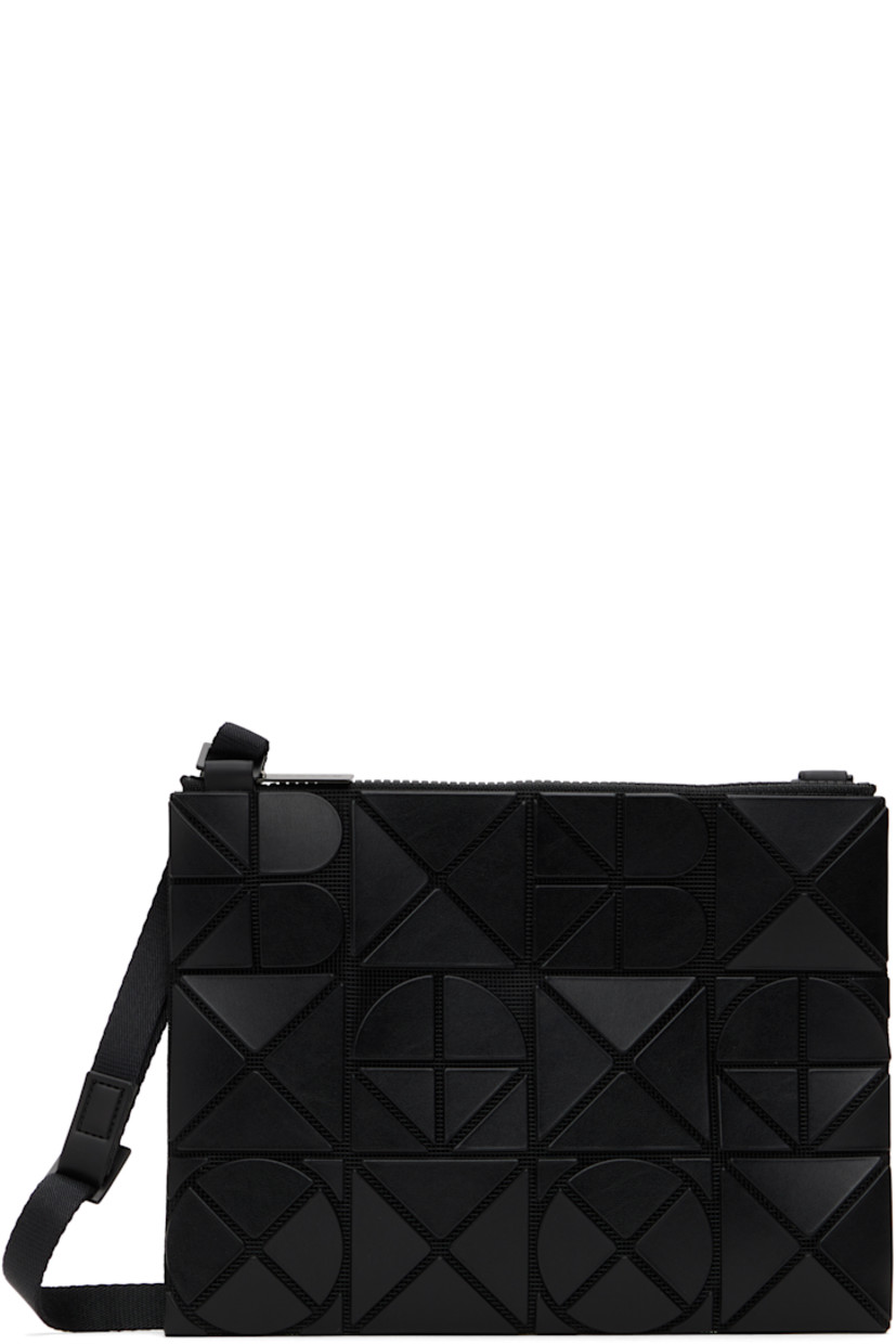 Mesh shoulder bag in black. 

· Triangular faux-leather logo appliqués throughout
· Adjustable crossbody strap
· Zip closure
· Zip pocket at interior
· Patterned textile lining
· H9" x W7"

Supplier color: Matte black