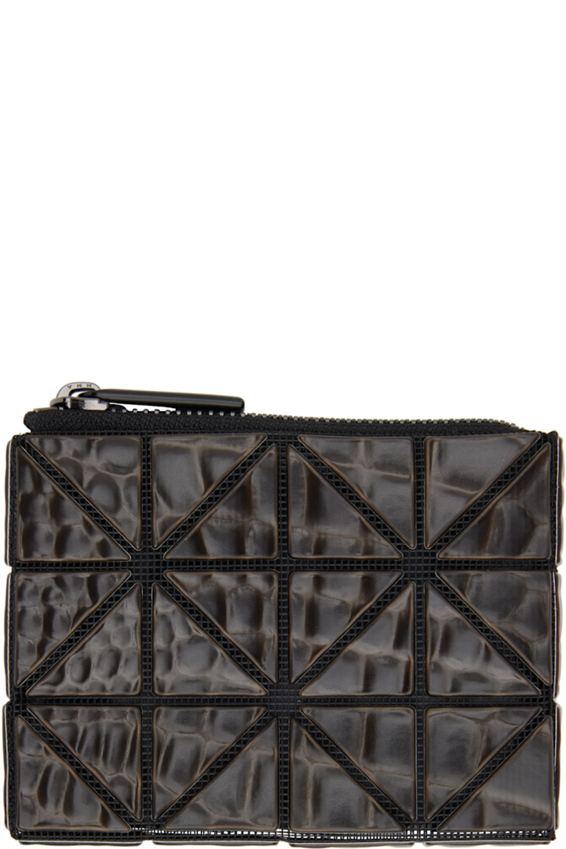 Mesh wallet in black. Croc-embossed signature triangular vinyl appliqués throughout.

· Zip closure
· D-ring and card slot at interior 
· Satin lining 
· Gunmetal-tone hardware
· H3.5" x W4.5" x D0.5"

Supplier color: Black