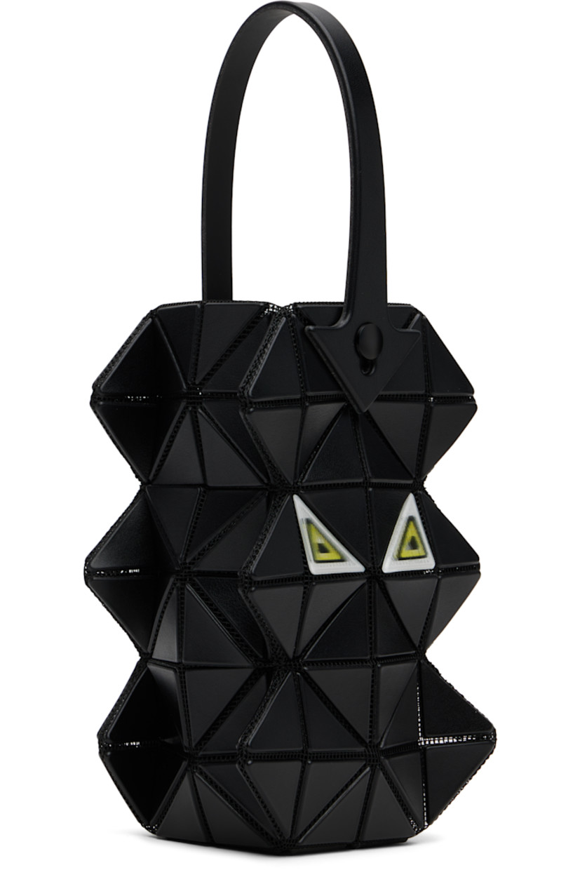 Sculptural mesh pouch.

· Signature triangular vinyl appliqués throughout
· Fixed carry handle
· Lenticular graphic appliqués at face and back face
· Logo-woven canvas lining
· H6" x W3.5" x D2"

Supplier color: Black