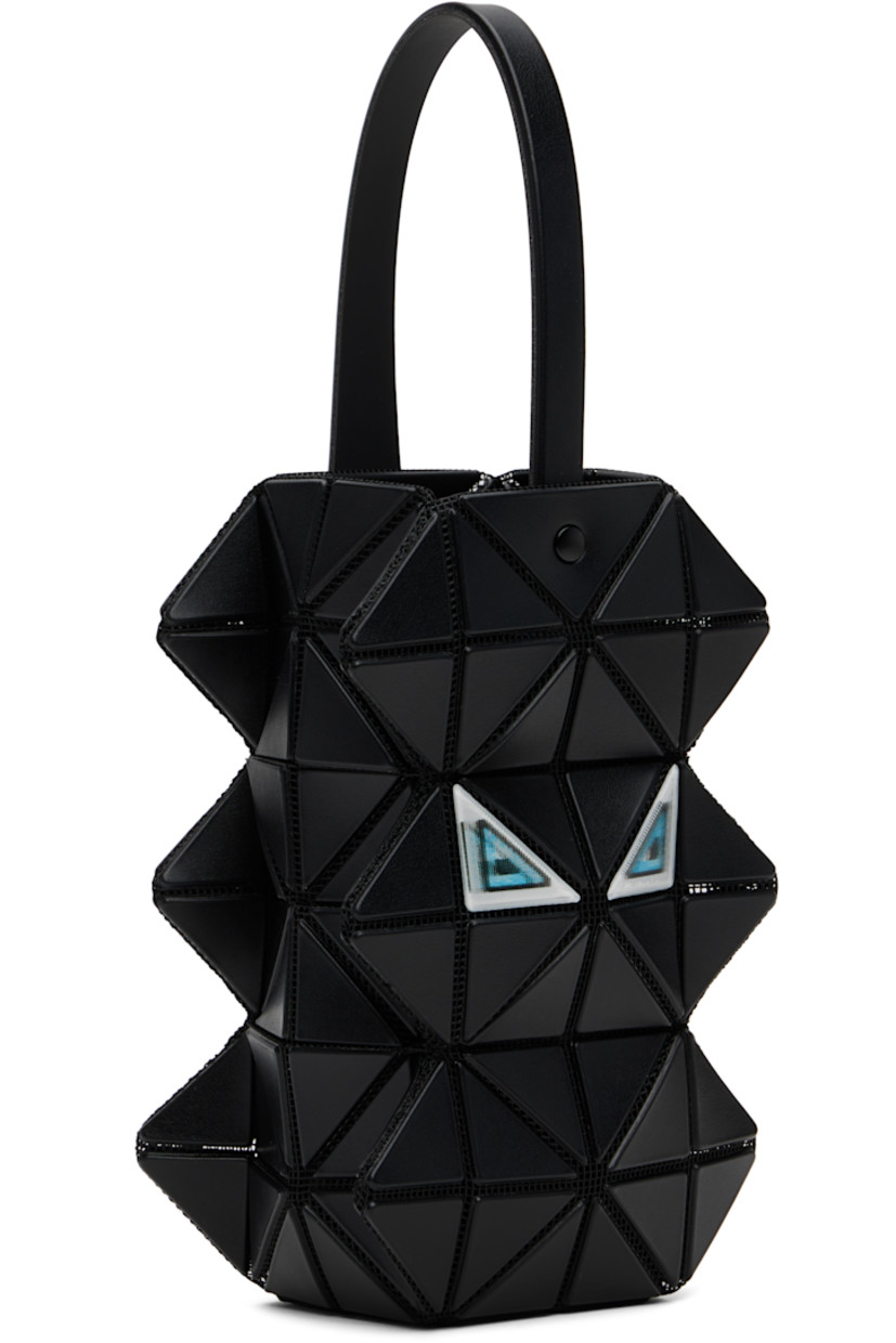 Sculptural mesh pouch.

· Signature triangular vinyl appliqués throughout
· Fixed carry handle
· Lenticular graphic appliqués at face and back face
· Logo-woven canvas lining
· H6" x W3.5" x D2"

Supplier color: Black